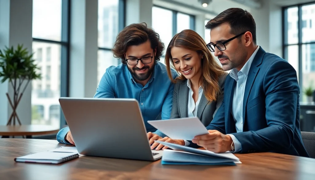Team of professionals engaging in real estate management discussions around a laptop.